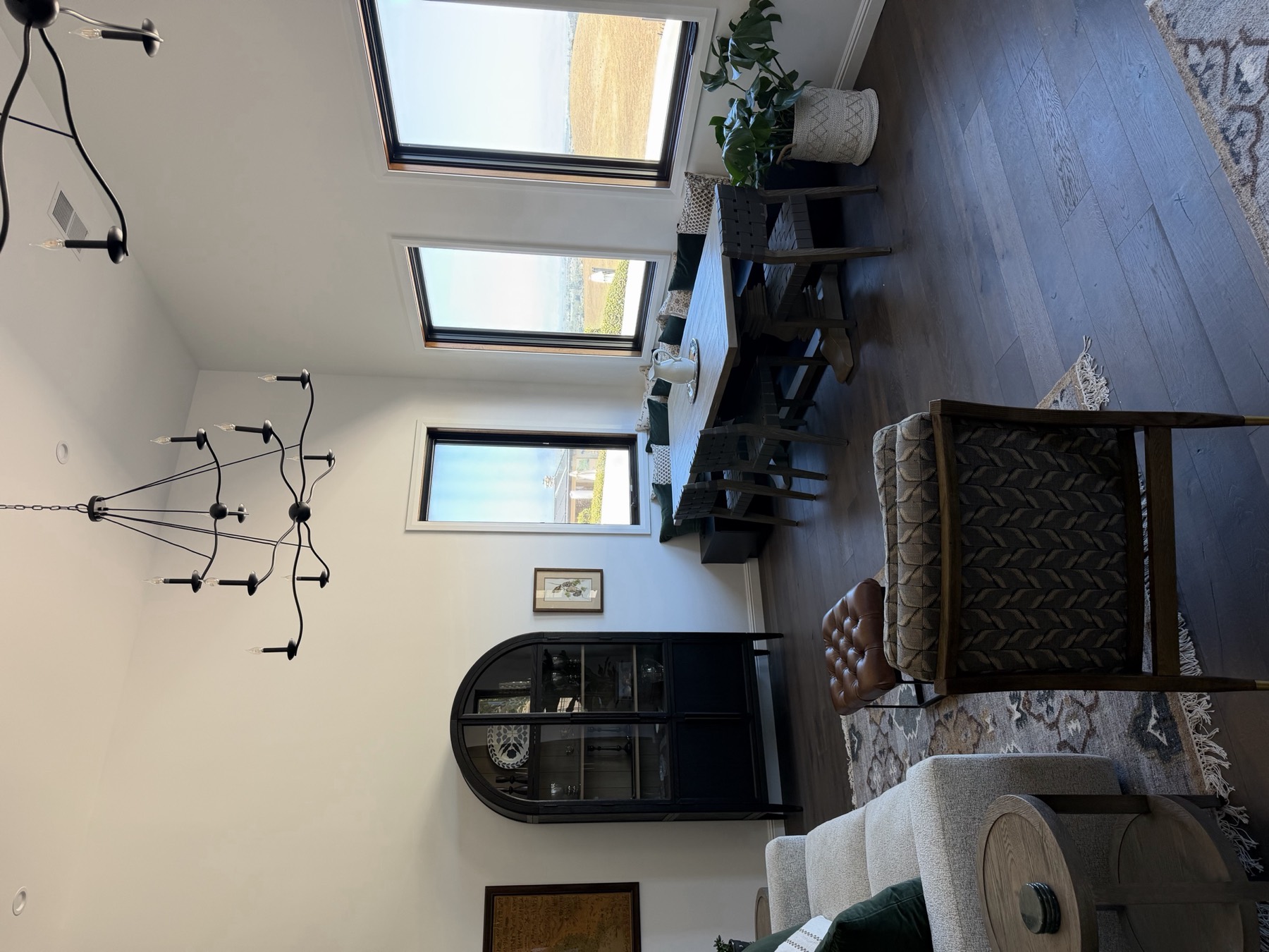 Custom home dining area with arched display cabinet